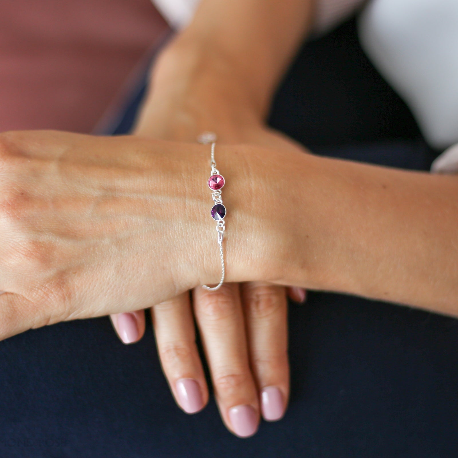 Close-up of a person's wrist wearing a bracelet with colorful beads.